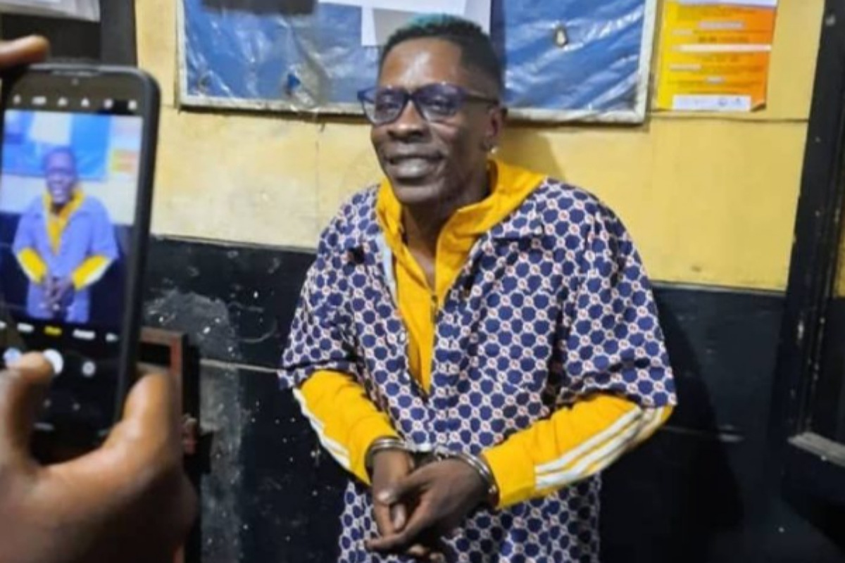 Shatta Wale pictured in handcuffs after he was busted by police over fake shooting incident